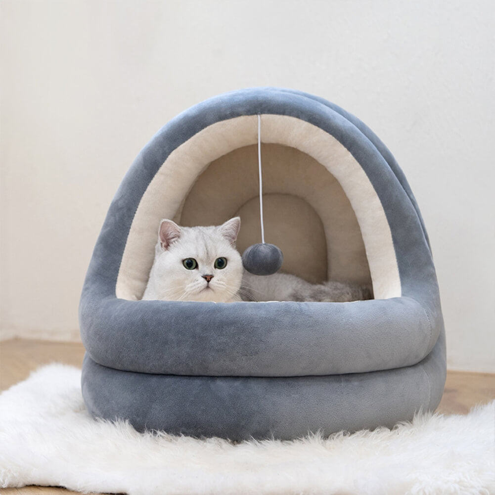 PurrFusion bed with white cat in it, on white plush carpet
