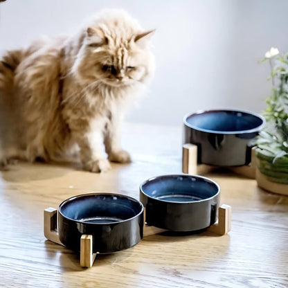 A long hair brown cat sit behind three CeraWooden Design Cat Bowls